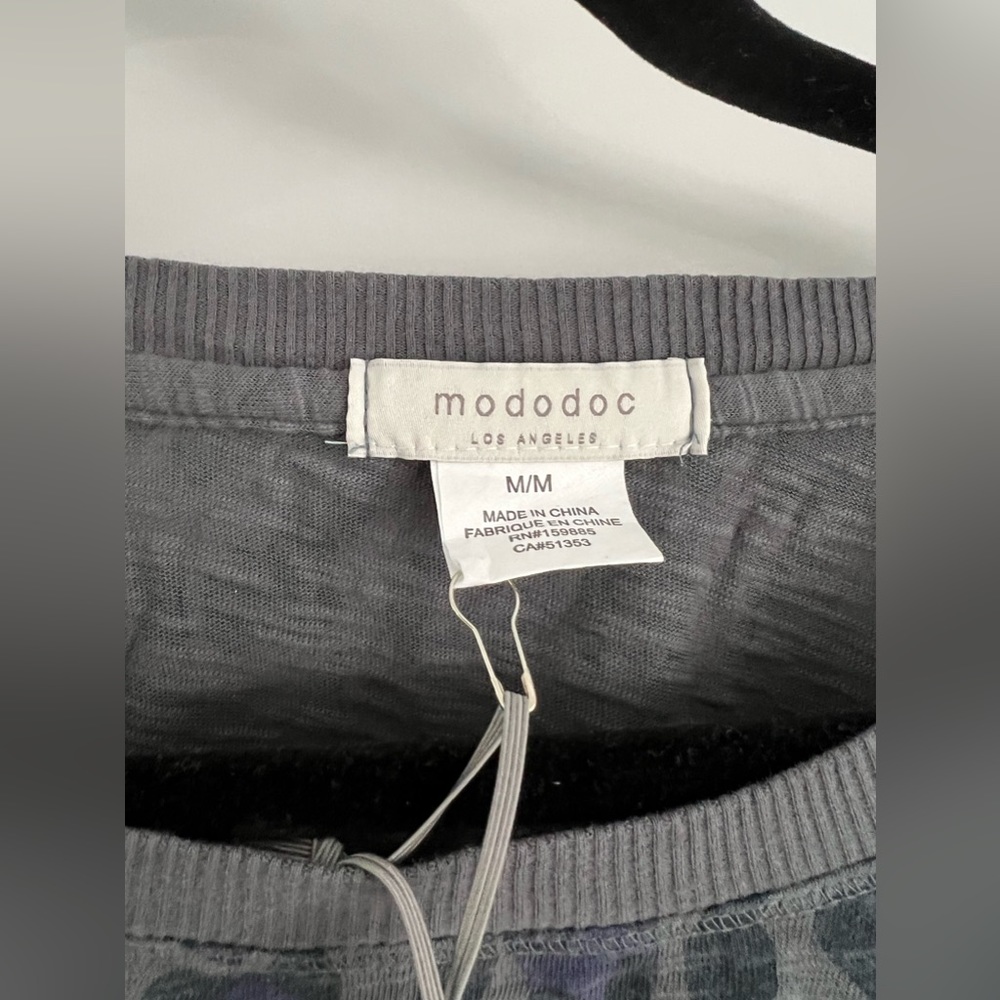 Never been worn, tags still on. Shorter in the front, longer in the back